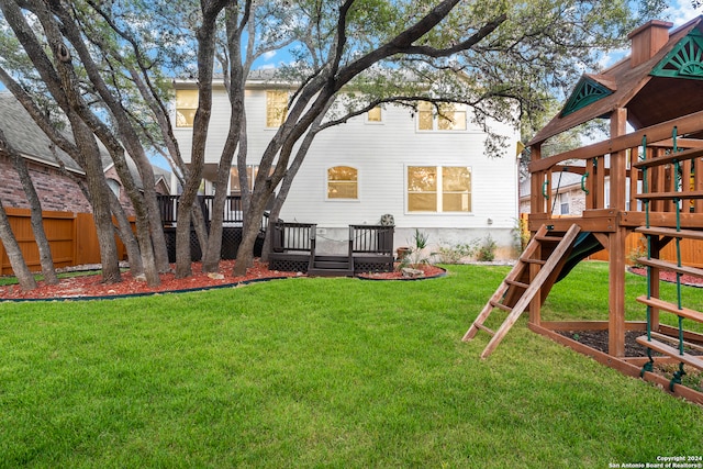 view of yard with a wooden deck