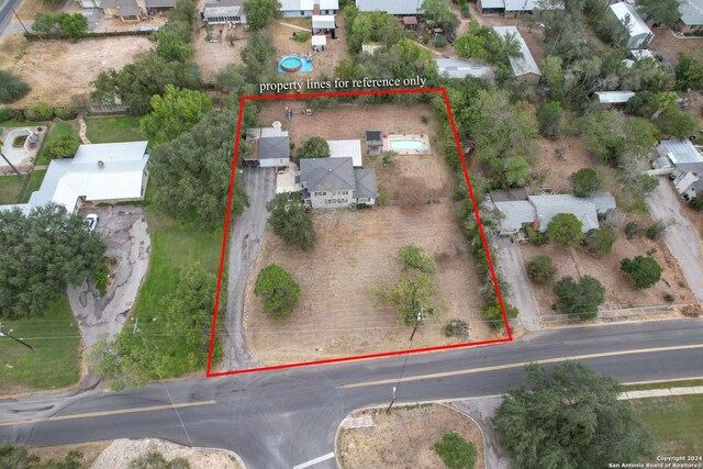 360 Benson Rd, Uvalde, TX 78801 - aerial perspective of suburban area featuring property parcel outlined