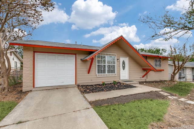 single story home with a garage