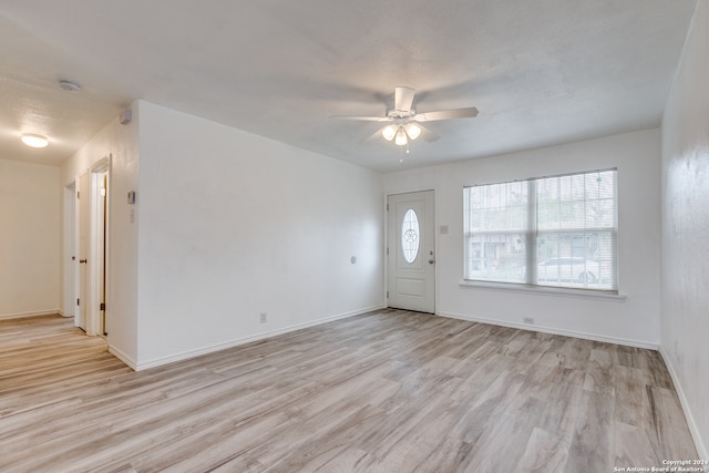 entrance foyer with light hardwood / wood-style floors and ceiling fan