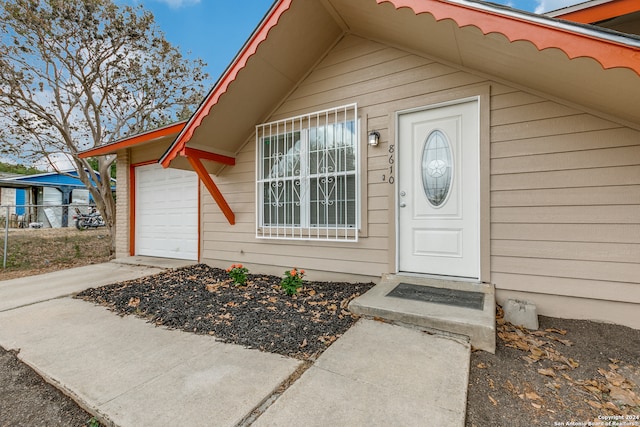 property entrance with a garage