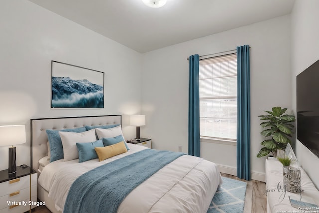 bedroom with light wood-type flooring