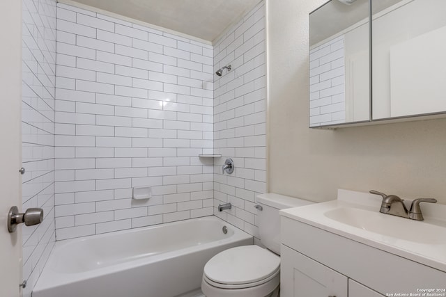 full bathroom with vanity, tiled shower / bath, and toilet