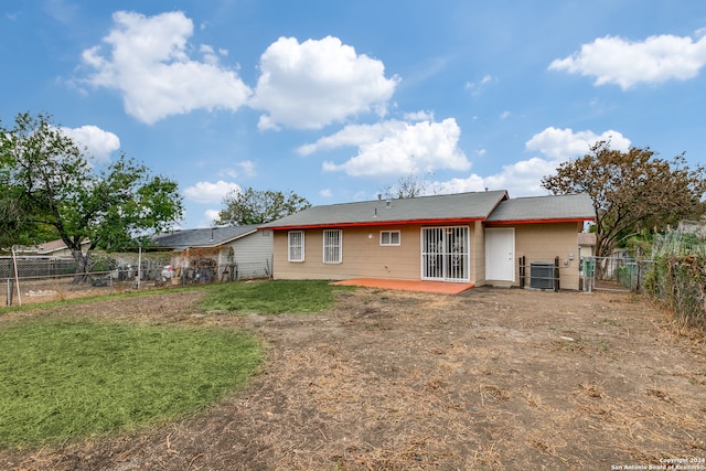 rear view of property featuring cooling unit