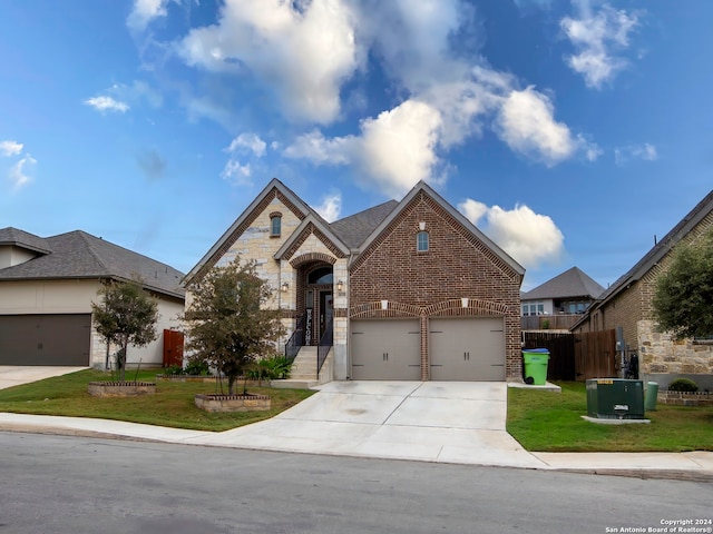 view of front of property with central air condition unit and a front lawn