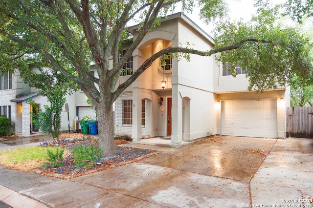 mediterranean / spanish-style home with a garage