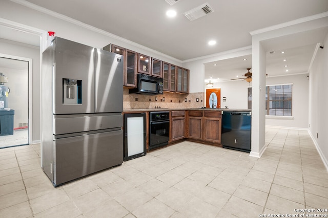 kitchen featuring black appliances, light tile patterned floors, sink, decorative backsplash, and ceiling fan