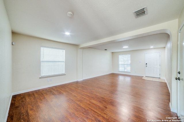 unfurnished room featuring dark hardwood / wood-style floors