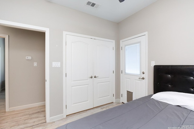 1403 S Young, Rockport, TX 78382 - bedroom with light wood-style floors, baseboards, a closet, and a ceiling fan