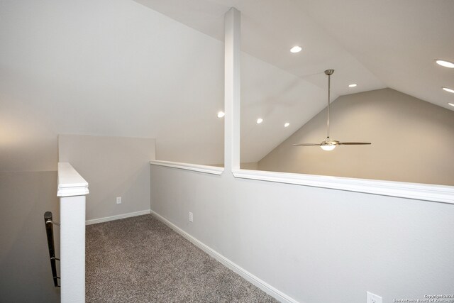 additional living space featuring ceiling fan, vaulted ceiling, and carpet