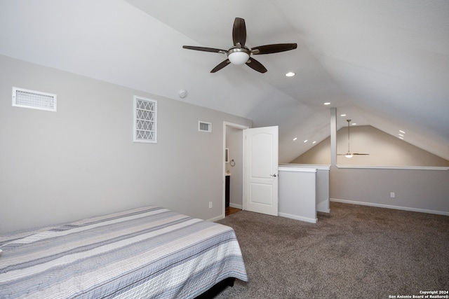 carpeted bedroom with ceiling fan and vaulted ceiling