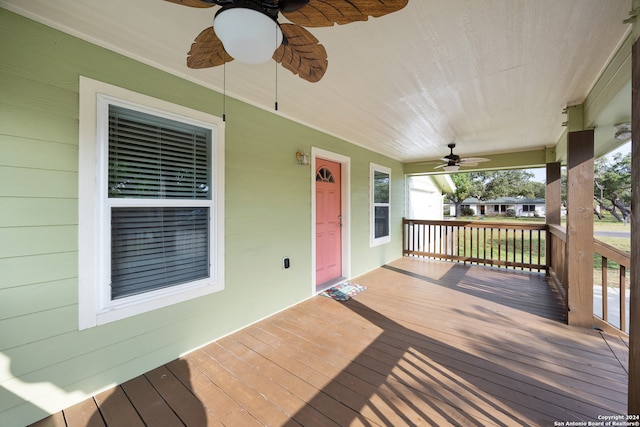 wooden deck with ceiling fan and covered porch