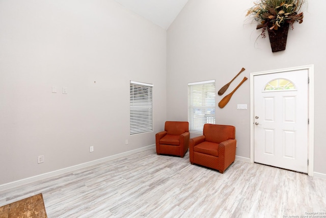 1403 S Young, Rockport, TX 78382 - sitting room with light wood-style flooring, high vaulted ceiling, and baseboards