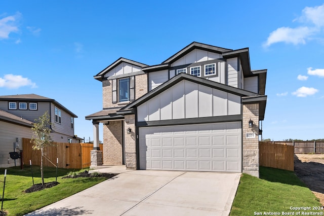 view of front facade featuring a front lawn and a garage