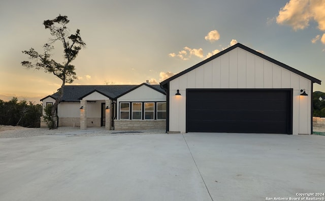 modern farmhouse style home with a garage