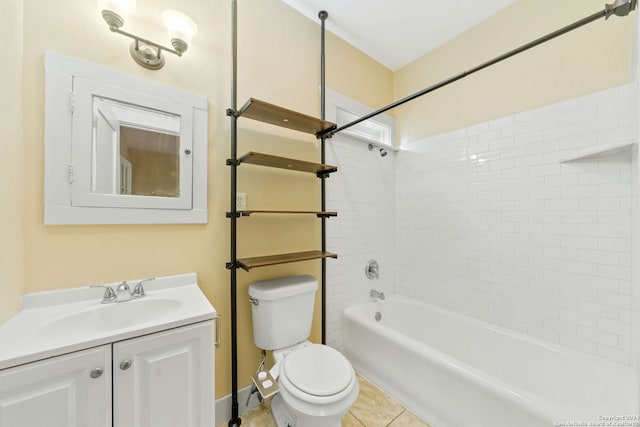 full bathroom featuring toilet, vanity, tiled shower / bath, and tile patterned flooring