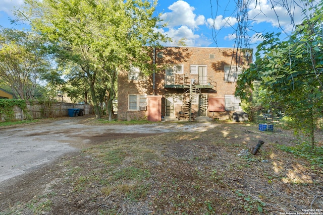 view of front facade with a wooden deck