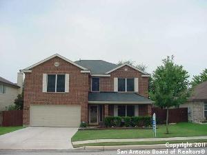 front of property with a garage and a front yard