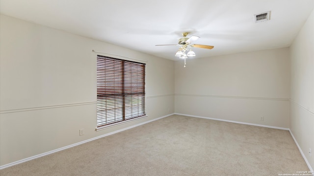 carpeted empty room with ceiling fan