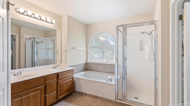 bathroom with vanity, plus walk in shower, and tile patterned floors