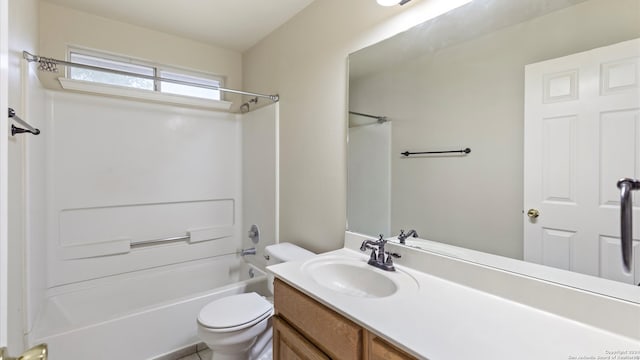 full bathroom with shower / tub combination, vanity, toilet, and tile patterned floors