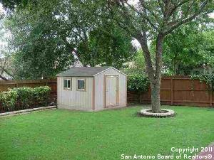 view of outbuilding featuring a yard