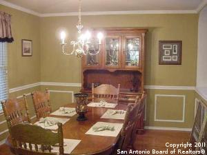 dining space with a chandelier and crown molding