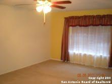 unfurnished room with ceiling fan