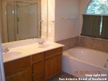 bathroom with vanity and a bathing tub