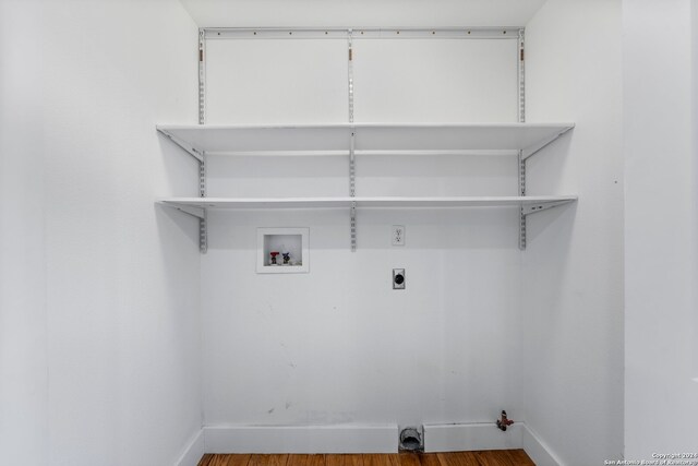 laundry room featuring hardwood / wood-style floors, electric dryer hookup, and hookup for a washing machine