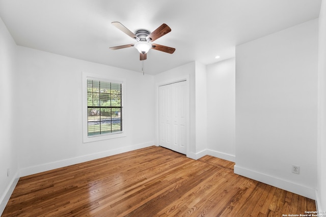 spare room with light hardwood / wood-style flooring and ceiling fan