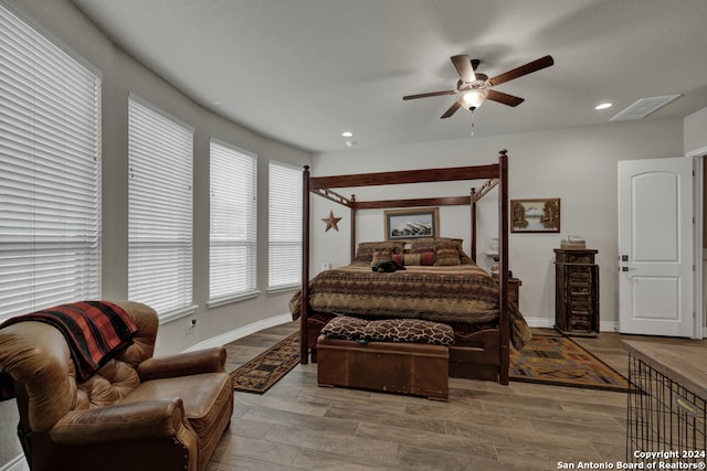 bedroom with hardwood / wood-style flooring and ceiling fan