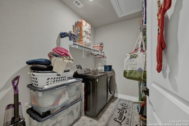 clothes washing area featuring independent washer and dryer