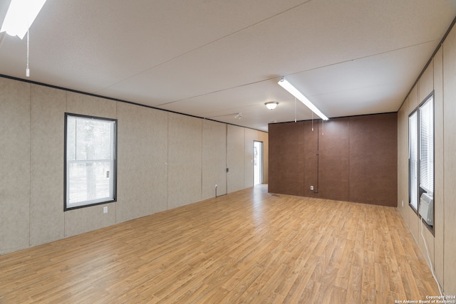 unfurnished room with light wood-type flooring