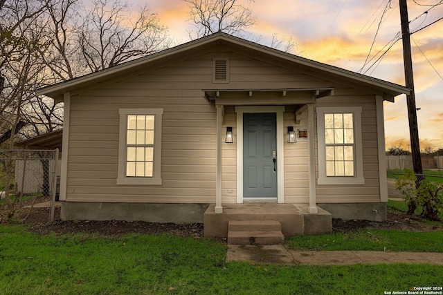 view of front of house with a yard