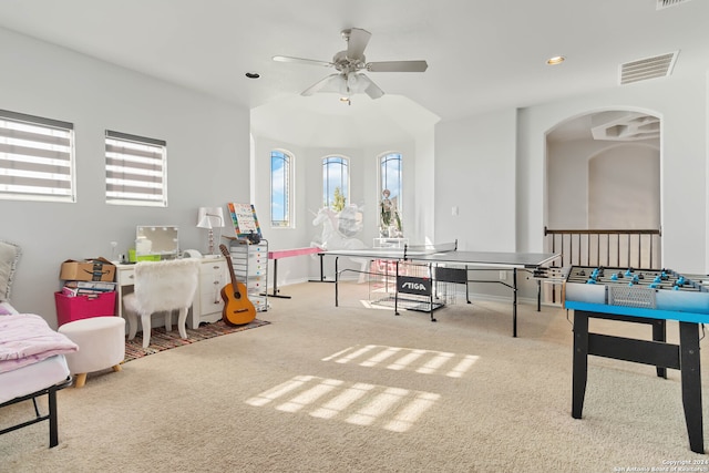 game room with light colored carpet and ceiling fan