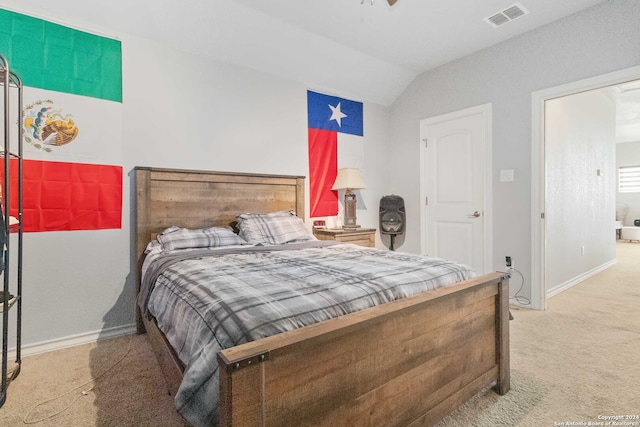 carpeted bedroom featuring lofted ceiling