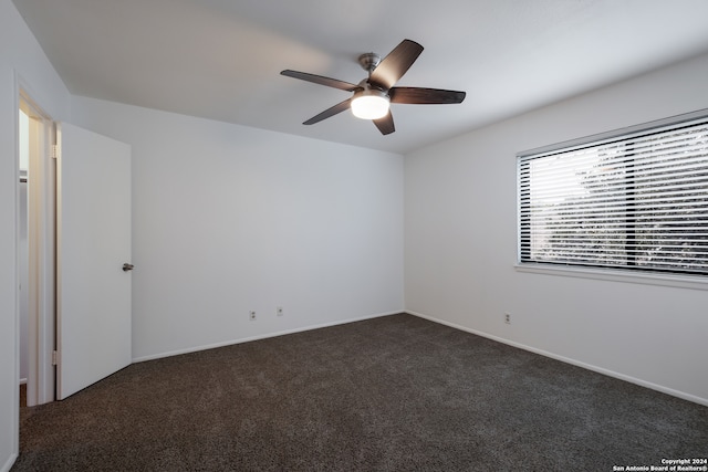 carpeted empty room with ceiling fan