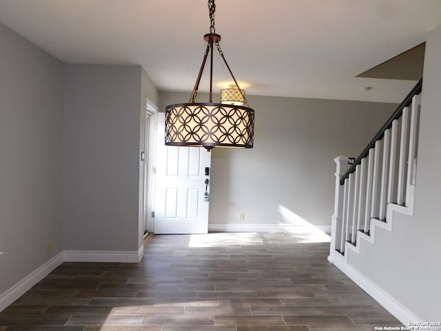 foyer entrance featuring dark hardwood / wood-style floors