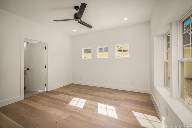 empty room featuring ceiling fan and light wood-type flooring