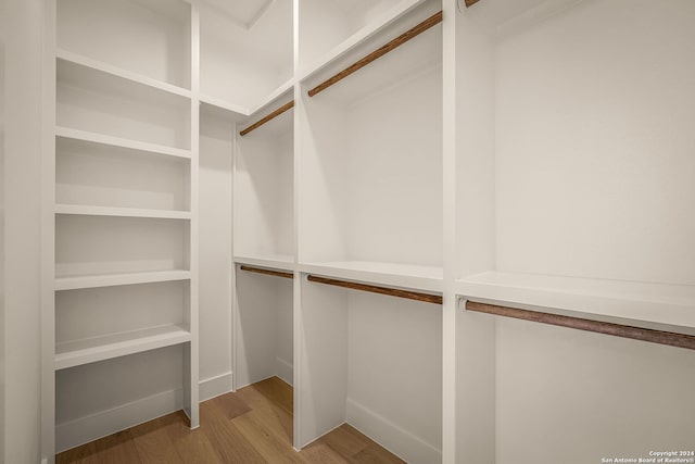 spacious closet featuring light hardwood / wood-style floors