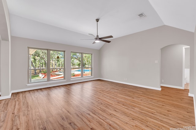 unfurnished living room featuring vaulted ceiling, ceiling fan, and light hardwood / wood-style flooring