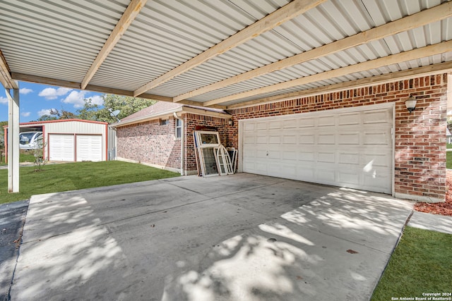 garage featuring a lawn