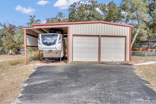 garage featuring a carport