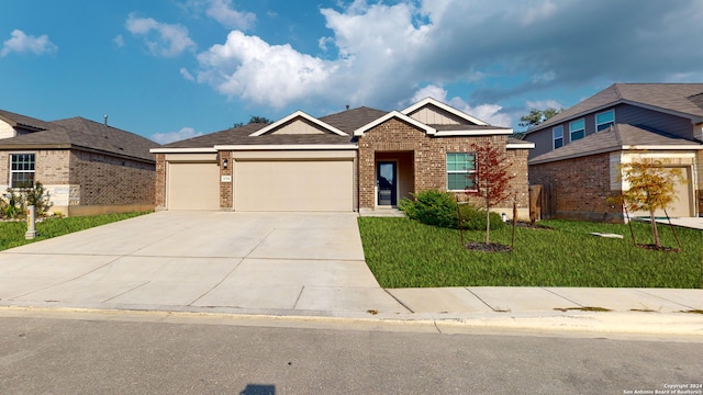 view of front of home with a garage and a front lawn