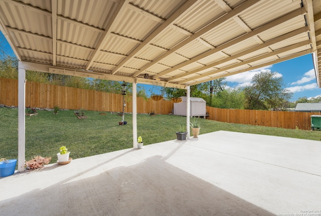 view of patio featuring a shed