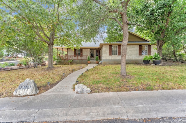 single story home featuring a front lawn and a porch