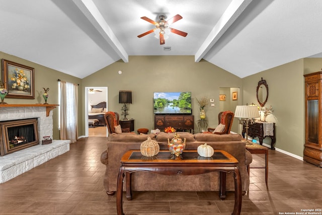 living room with ceiling fan, vaulted ceiling with beams, and a fireplace