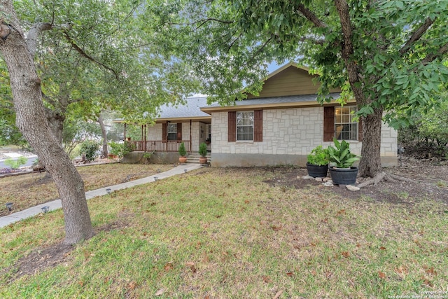 ranch-style house with a porch and a front yard