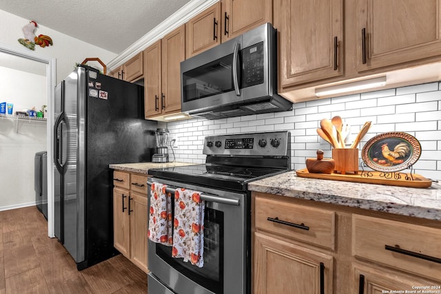 kitchen with stainless steel appliances, light stone counters, a textured ceiling, tasteful backsplash, and dark hardwood / wood-style floors